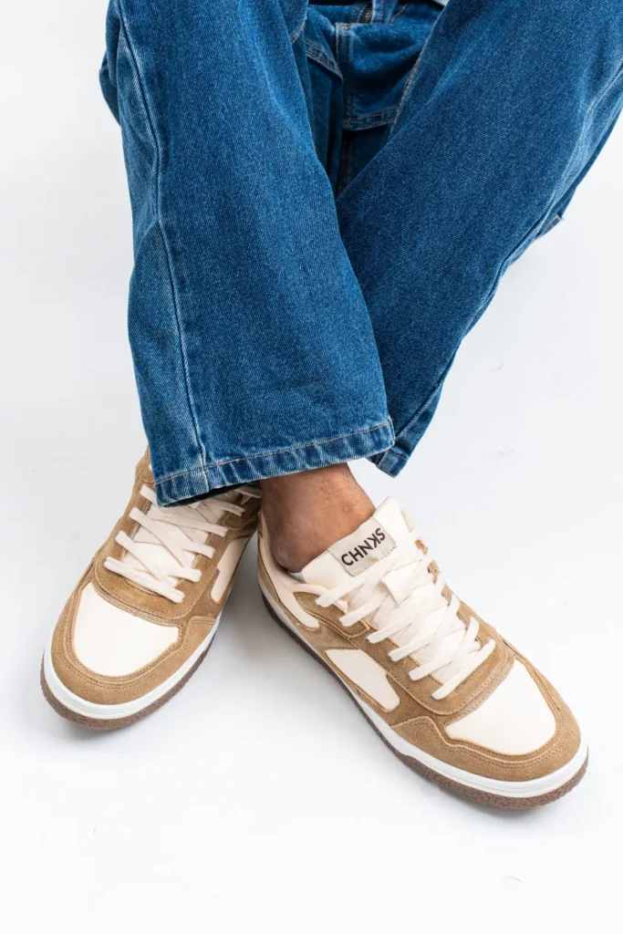 Dunescape CHNKS sneakers on men’s feet side angle – tan beige sneakers for daily comfort