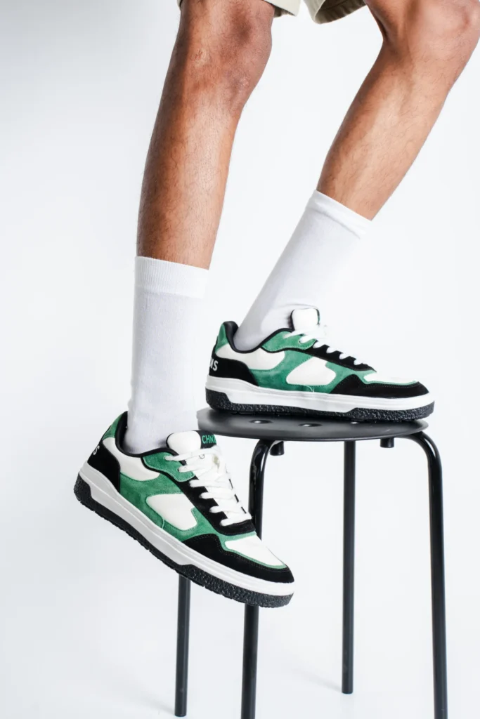 Matrix CHNKS sneakers on leg – men’s green sneakers for everyday street style