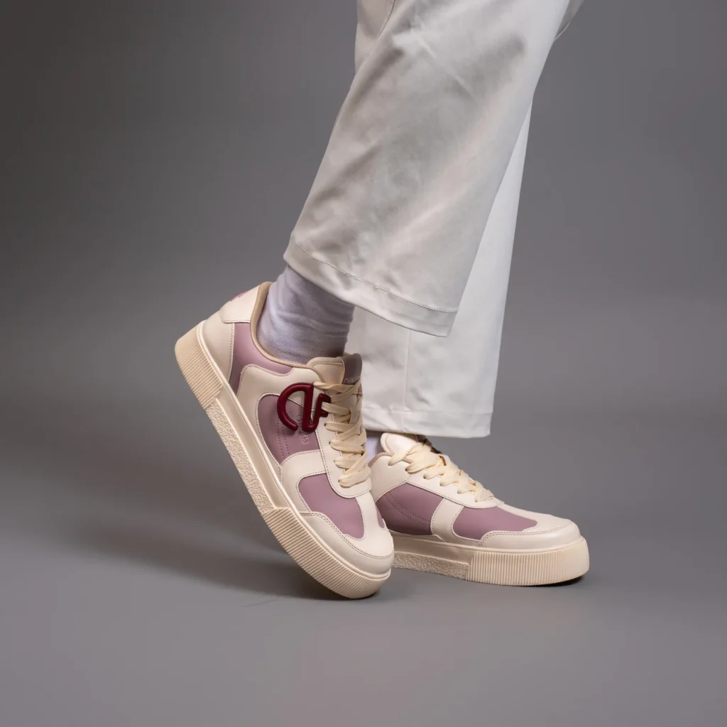 Bubblegum CHNKS pink and white sneakers lifestyle image – casual streetwear style with white trousers