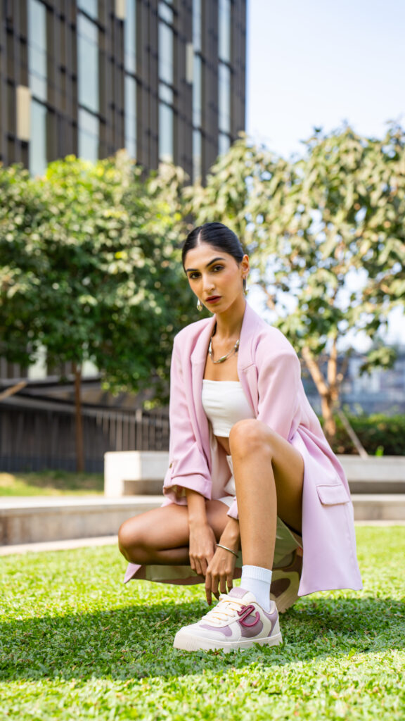 A confident woman wearing CHNKS sneakers that blend street style with elegance, redefining women’s sneaker fashion in India.